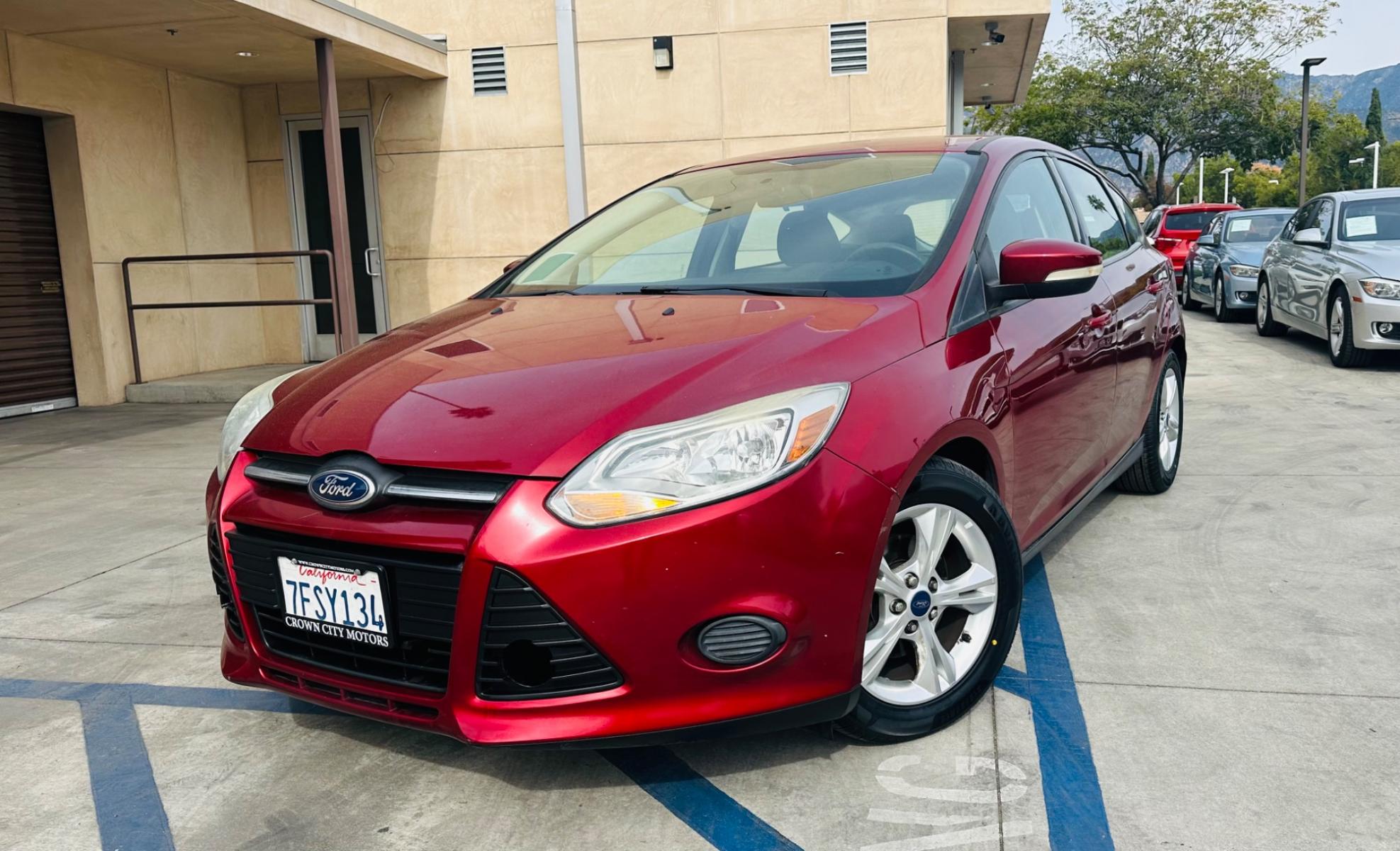 2014 RED /Gray Ford Focus Cloth (1FADP3K24EL) with an 4 Cylinders engine, Automatic transmission, located at 30 S. Berkeley Avenue, Pasadena, CA, 91107, (626) 248-7567, 34.145447, -118.109398 - Good Value! Good MPG! - Photo #0